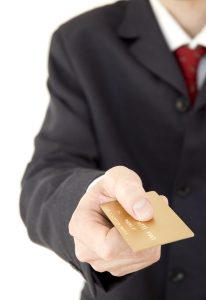 businessman holding a credit card